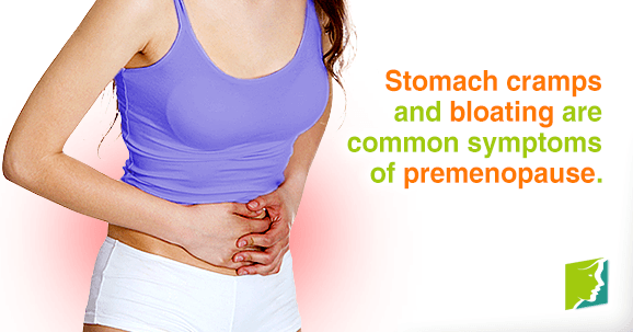 Stomach cramps and bloating are common symptoms of premenopause.