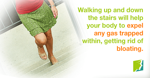 Walking up and down stairs will help your body expel any gas trapped within, getting rid of bloating